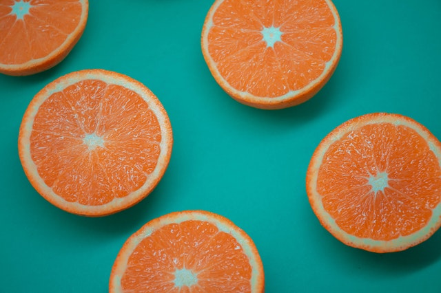 Oranges on a teal background
